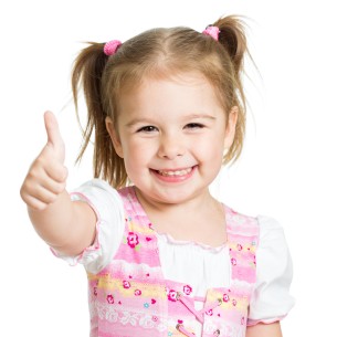 little girl with thumbs up Dental Care Center