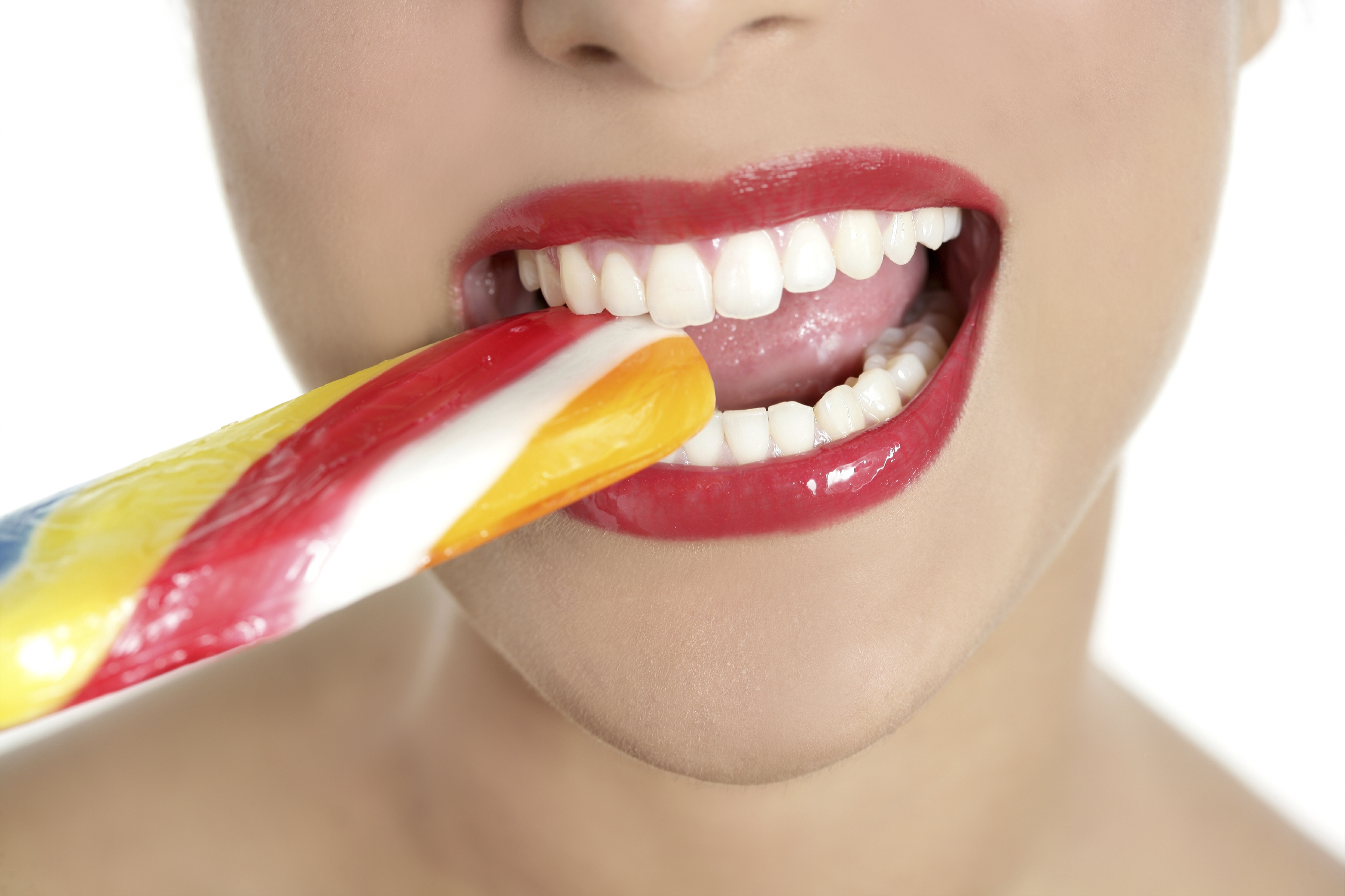 woman biting on lollipop Dental Care Center