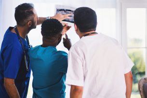 dentists looking at xray Dental Care Center