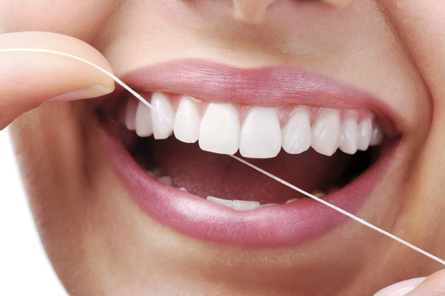 woman flossing her teeth Dental Care Center