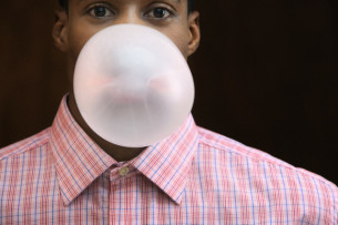 man blowing bubble Dental Care Center