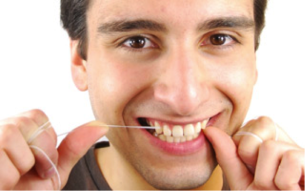 man flossing teeth Dental Care Center