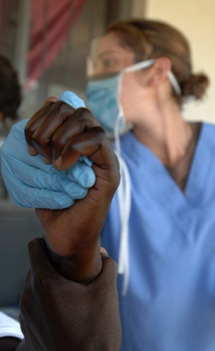 dentist holding patient's hand Dental Care Center