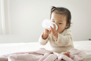 baby drinking a bottle Dental Care Center