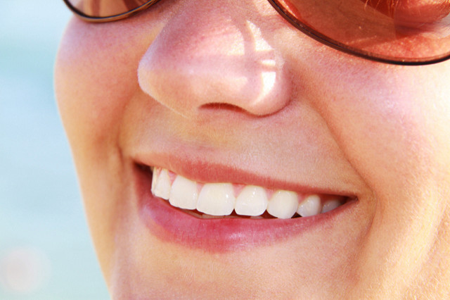 woman smiling Dental Care Center