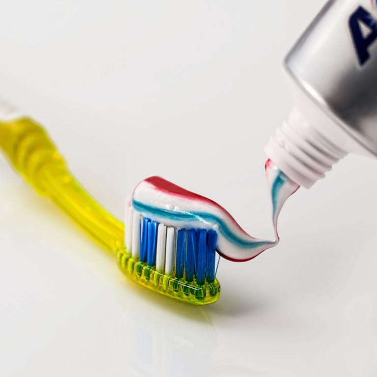 toothbrush and toothpaste Dental Care Center